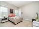 Cozy bedroom featuring neutral tones, soft carpet, and a comfortable-looking bed at 10016 St Kitts Landing Ln, Charlotte, NC 28278