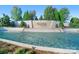 Beautiful entrance to The Palisades community with cascading water feature and lush landscaping at 10016 St Kitts Landing Ln, Charlotte, NC 28278