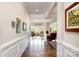 Elegant hallway with hardwood floors that lead to a bright living area with large windows at 10016 St Kitts Landing Ln, Charlotte, NC 28278