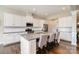 Open concept kitchen with a large island, granite countertops, and stainless steel appliances at 10016 St Kitts Landing Ln, Charlotte, NC 28278