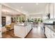 Open-concept kitchen with island and views of dining area and living room, perfect for entertaining at 10016 St Kitts Landing Ln, Charlotte, NC 28278