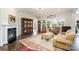Living room with fireplace and large windows that offer great views, filled with natural light at 10016 St Kitts Landing Ln, Charlotte, NC 28278