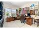 Inviting home office with a large window, classic furnishings, and walls adorned with artwork at 10016 St Kitts Landing Ln, Charlotte, NC 28278