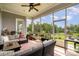 Relaxing screened porch furnished with comfortable seating, offering a view of the landscaped backyard at 10016 St Kitts Landing Ln, Charlotte, NC 28278