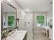 Elegant bathroom with a glass-enclosed shower, marble vanity, and contemporary finishes at 1021 Nancy Dr, Charlotte, NC 28211