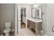 Bright bathroom featuring a double vanity, walk-in shower, and modern fixtures at 1021 Nancy Dr, Charlotte, NC 28211