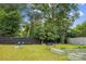 Large backyard with fence and raised garden beds at 107 Hinton St, Chester, SC 29706