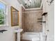 Bathroom featuring a shower and bathtub combo with brown tile at 107 Hinton St, Chester, SC 29706