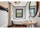 Charming bathroom with clawfoot tub, pedestal sink, and vintage fixtures at 107 Hinton St, Chester, SC 29706