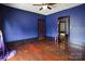 Bedroom featuring purple walls, hardwood floors and lots of natural light at 107 Hinton St, Chester, SC 29706