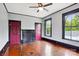 Bright bedroom with two windows, ceiling fan, fireplace and hardwood flooring at 107 Hinton St, Chester, SC 29706