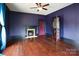 Bedroom with blue walls, hardwood floors and a fireplace at 107 Hinton St, Chester, SC 29706
