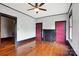Bedroom with hardwood floors, ceiling fan, and two doorways at 107 Hinton St, Chester, SC 29706