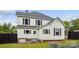 Two-story home with white siding and black shutters at 107 Hinton St, Chester, SC 29706