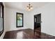 Bright room with hardwood floors, dark trim, and vintage chandelier lighting at 107 Hinton St, Chester, SC 29706