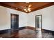 The living room features dark trim, hardwood floors, and a brick fireplace at 107 Hinton St, Chester, SC 29706