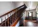 Detailed view of the staircase with dark wood railing and trim at 107 Hinton St, Chester, SC 29706
