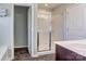 Bathroom with a glass-enclosed shower and stylish vanity with modern fixtures at 1077 River Haven Sw Ave, Concord, NC 28025