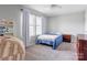 Comfortable bedroom with neutral walls and carpet, featuring a window for natural light at 1077 River Haven Sw Ave, Concord, NC 28025