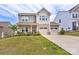Charming two-story home featuring a two-car garage, covered porch and a well-manicured lawn at 1077 River Haven Sw Ave, Concord, NC 28025