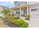 Charming front porch with stone accents, seating, and well-maintained landscaping at 1077 River Haven Sw Ave, Concord, NC 28025