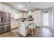 Well-lit kitchen featuring white cabinets, granite countertops and stainless steel appliances at 1077 River Haven Sw Ave, Concord, NC 28025