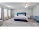 Bright main bedroom with ample natural light, ensuite bath, plush carpet, and neutral walls at 1077 River Haven Sw Ave, Concord, NC 28025