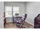 Bright office space with wood floors, large window, and a comfortable leather chair at 1077 River Haven Sw Ave, Concord, NC 28025