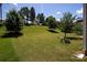 Picturesque backyard featuring mature trees, a bird bath, and plenty of green space, perfect for outdoor enjoyment at 10792 Elsfield Nw Ave, Concord, NC 28027