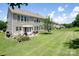 Expansive backyard with a well-maintained lawn, ideal for relaxing and entertaining outdoors at 10792 Elsfield Nw Ave, Concord, NC 28027