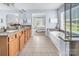 Bathroom with dual sinks, wooden cabinets and a soaking tub, offering a spa-like experience at 10792 Elsfield Nw Ave, Concord, NC 28027