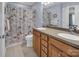 Charming bathroom featuring a double vanity, Eiffel Tower shower curtain, and ample counter space at 10792 Elsfield Nw Ave, Concord, NC 28027