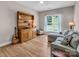 Comfortable bedroom featuring a large window, stylish furniture, and plenty of natural light at 10792 Elsfield Nw Ave, Concord, NC 28027