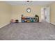 Bright bonus room with a storage area, perfect for play or hobby space at 10792 Elsfield Nw Ave, Concord, NC 28027