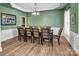Charming dining room with classic decor, wood floors, and modern lighting at 10792 Elsfield Nw Ave, Concord, NC 28027