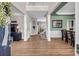 Welcoming foyer with hardwood floors, a view of the staircase, and an open layout connecting to the living spaces at 10792 Elsfield Nw Ave, Concord, NC 28027