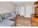 Relaxing living room with a comfortable sectional sofa and wooden dresser, perfect for entertaining at 10792 Elsfield Nw Ave, Concord, NC 28027