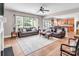 Expansive living room with wood floors, sofas, and a view into the modern kitchen at 10792 Elsfield Nw Ave, Concord, NC 28027