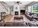 Spacious living room featuring a fireplace, ample seating, and natural light at 10792 Elsfield Nw Ave, Concord, NC 28027