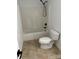 A bathroom featuring a shower-tub combo with white tile backsplash and chrome fixtures at 111 Billy Joe Rd, Mooresville, NC 28117