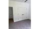 Bedroom featuring carpet, an interior door and a closet with double doors at 111 Billy Joe Rd, Mooresville, NC 28117