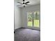Bedroom with plush carpet and a large window at 111 Billy Joe Rd, Mooresville, NC 28117