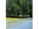 Inviting gray painted deck with white trim overlooks a lush backyard and greenery at 111 Billy Joe Rd, Mooresville, NC 28117