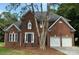 Beautiful brick two story house with manicured lawn and an attached two car garage at 111 Billy Joe Rd, Mooresville, NC 28117