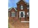 Charming brick two-story home with a welcoming front entrance and mature landscaping at 111 Billy Joe Rd, Mooresville, NC 28117