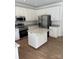 Spacious kitchen showcasing white cabinets, stainless steel appliances, and granite countertops on the kitchen island at 111 Billy Joe Rd, Mooresville, NC 28117