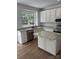 Stylish kitchen with white cabinets, granite countertops, stainless steel appliances, and a view from the kitchen window at 111 Billy Joe Rd, Mooresville, NC 28117