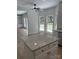 Bright eat-in kitchen area featuring a bay window that brings in plenty of natural light, adjacent to the living room at 111 Billy Joe Rd, Mooresville, NC 28117