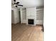 Bright living room with hardwood floors, fireplace, and custom built-in shelving at 111 Billy Joe Rd, Mooresville, NC 28117