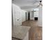 Open-concept living space with a fireplace, built-in shelving, and hardwood flooring, next to the kitchen at 111 Billy Joe Rd, Mooresville, NC 28117